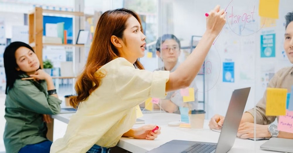 asia-businesswoman-social-distancing-new-normal-situation-virus-prevention-while-using-laptop-presentation-colleagues-about-plan-video-call-while-work-office-life-after-corona-virus-1.jpg